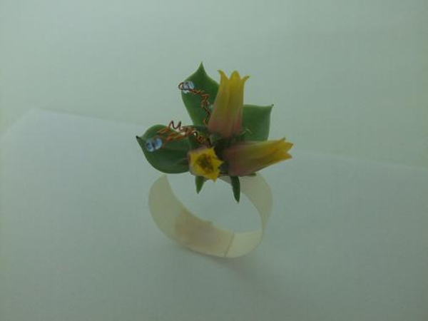 Glue flowers onto a flat paper base