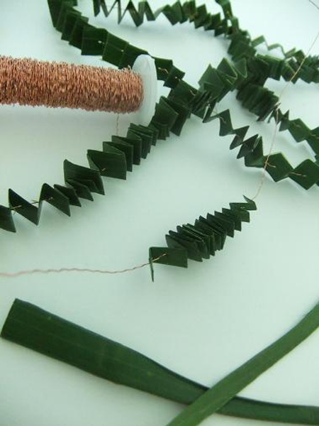 Folding a pleated garland out of foliage
