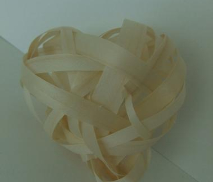 Weaving a heart from shaved wood strips