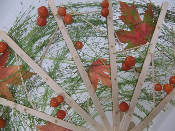 Weave the Viburnum berries into the floral fan design