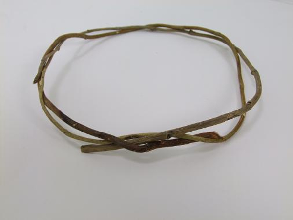 Gently bend the twig and guide it around the loop Gently bend the twig and guide it around the loop