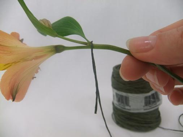Hook the wire around the Alstroemeria flower stem