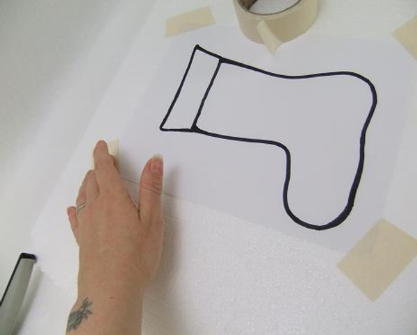 Tape the drawing of the stocking on to a sheet of Polystyrene
