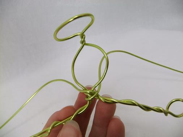 Wrap the wire to create a neck and twist it over to start the wing shape
