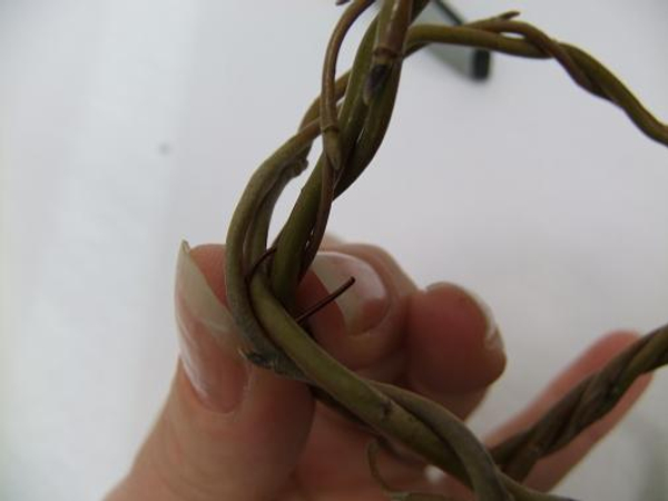 Slip the hairpin through and around the biggest willow pieces Slip the hairpin through and around the biggest willow pieces