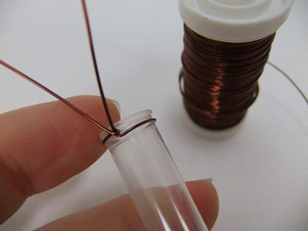 Secure the wire by twisting it around the test tube