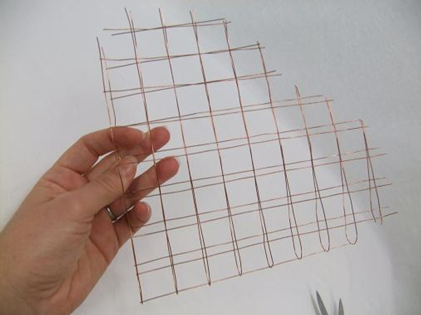 The fold in the copper mesh becomes one long side of the heart shape
