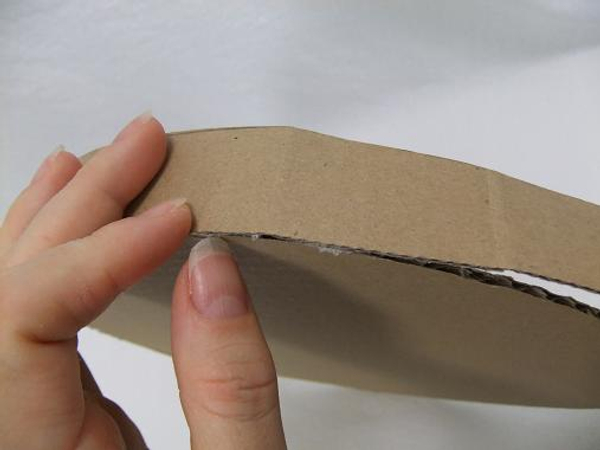 Fold the cardboard to curve