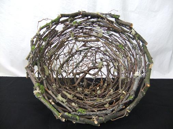 Stack and glue twigs to create a twig nest