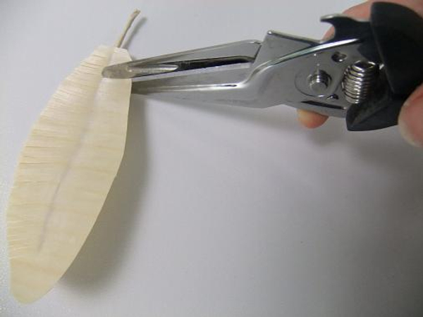 Cut the Barb by cutting into the grain of the wood.