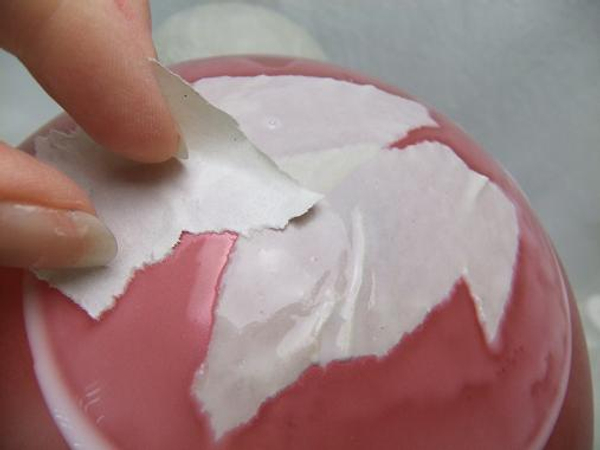 Paint a section with runny glue and paste the paper. Paint a section with runny glue and paste the paper.
