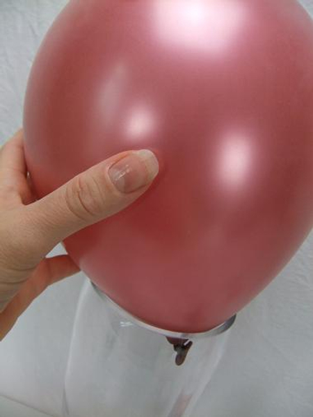 Place the balloon in a heavy vase.