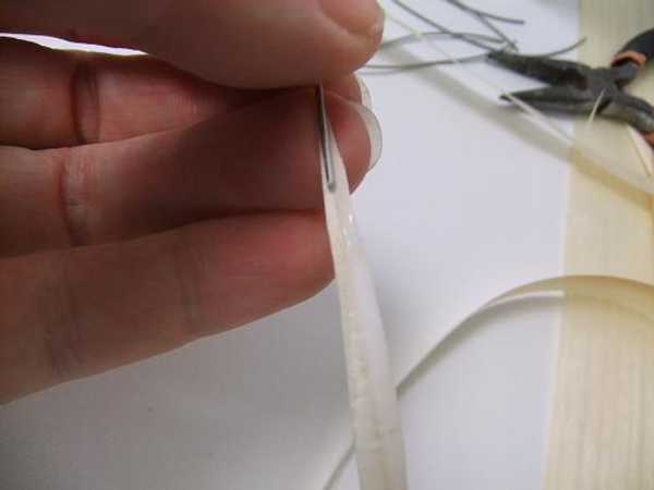 Place the wire on the wet glue.
