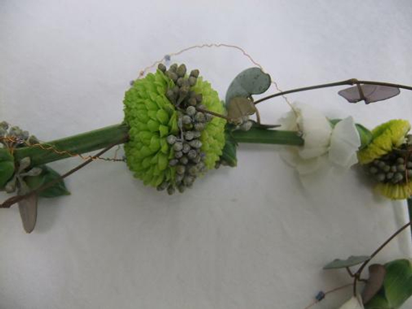 Rosary vine, wire and beads decorate the floral lariat necklace.