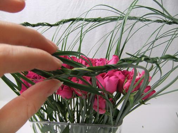 Weave the braid into the first section. Weave the braid into the first section.