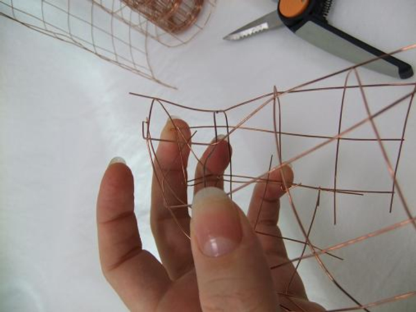 Create a pebble shape and fold the end wires in.