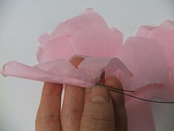 Gently roll the petal to create a bud.