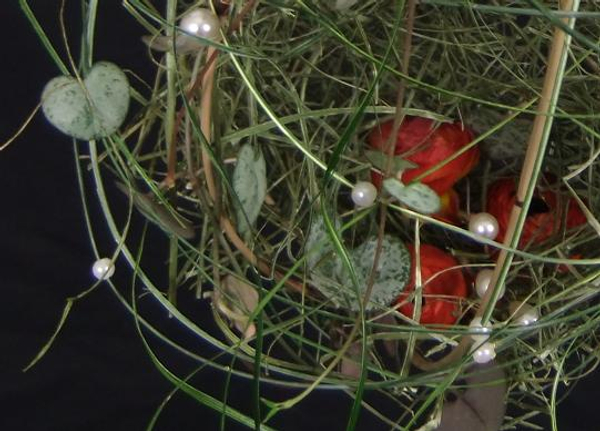 Ranunculus, flax and Rosary vine nest .