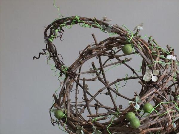 The green berries are paper covered baubles and the blossoms are dried hydrangea florets.