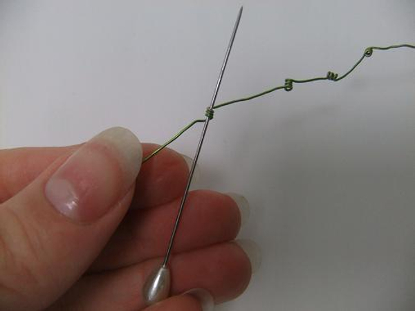 Wrap the wire around a corsage pin.