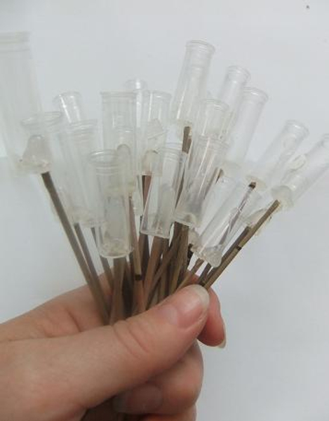 A bunch of test tubes on sticks.