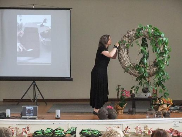 Anchoring the passion fruit vine to the bark wreath.