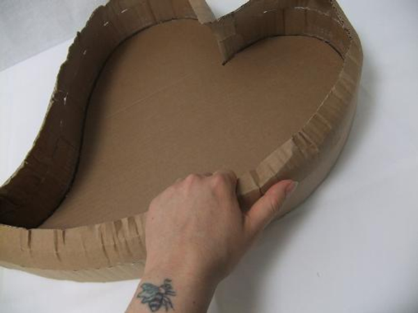 Break the sharp edges by bending the cardboard in your hand.