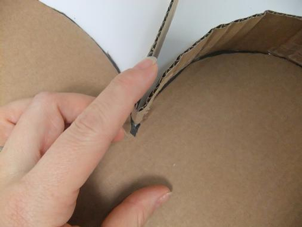 Fold the cardboard to create a sharp v at the top.jpg