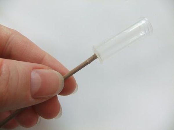 Glue a reed to a test tube.