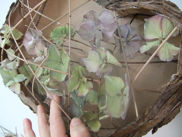 Hold each stick in place for a few seconds for the hot glue to dry.