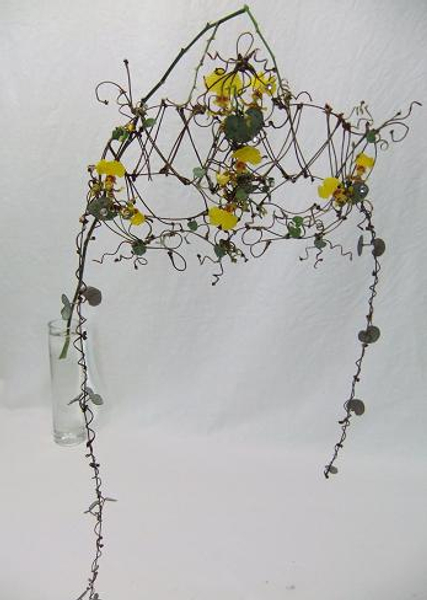 Intricate cherry twig, rosary vine and oncidium orchids.