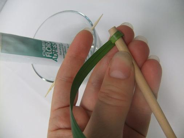 Roll a blade of grass around a thin dowel.