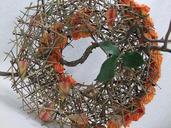 Roses nestles into the round shape.