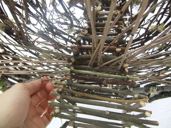 Weave some of the Mikado reeds to go over and under other reeds to secure the structure.