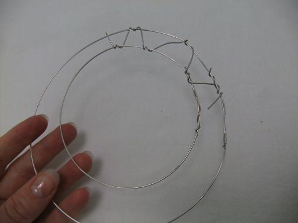Connect the two circles with wire.