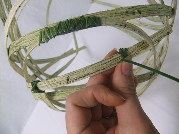 Cut and tie a second short section to the bottom of the basket frame.