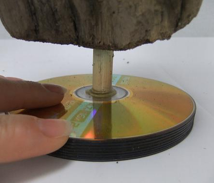 Up-cycle CD base for driftwood