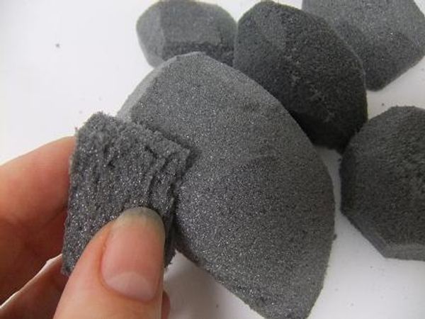Sand the pebble to a smooth shape with a small piece of foam.