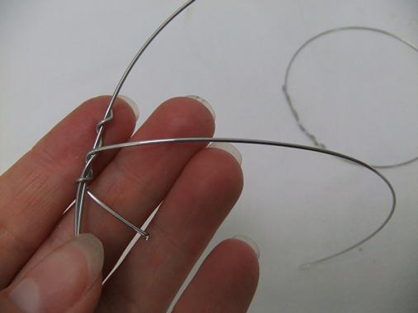 Secure the wire by twisting it around the circle.
