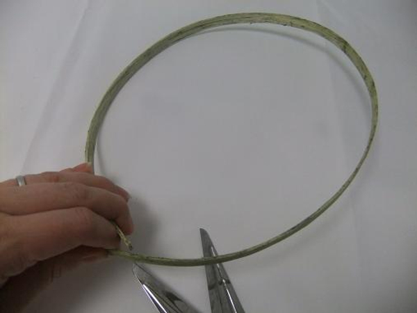 Shape the Midelino cane coils in a oval.