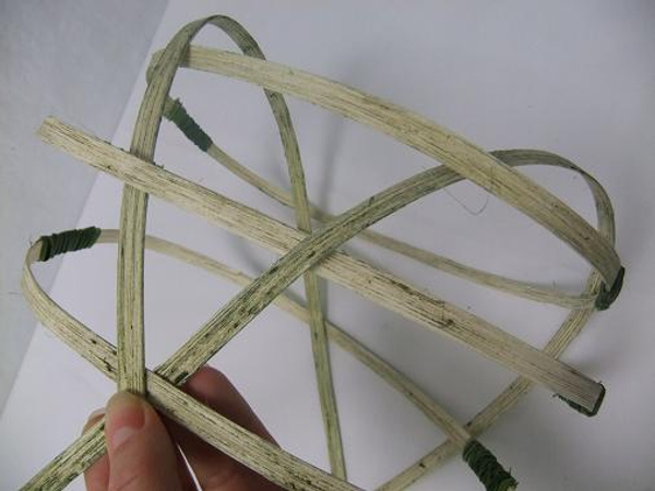 Spread out the cane sections to shape the basket.