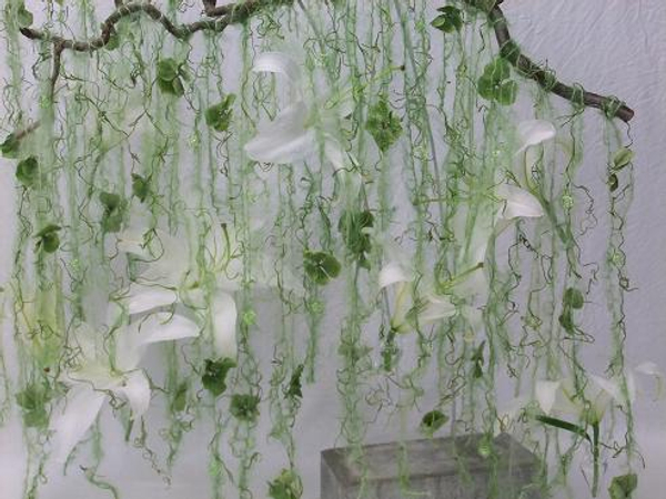 Stringing wool, Spanish moss, hydrangea and lilies.