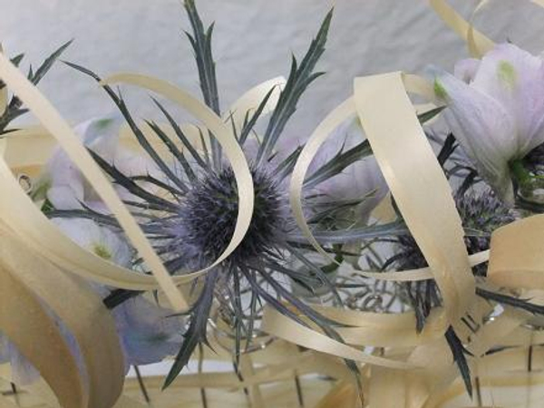 Strips of Kyogi paper and Delphinium and Sea holly.