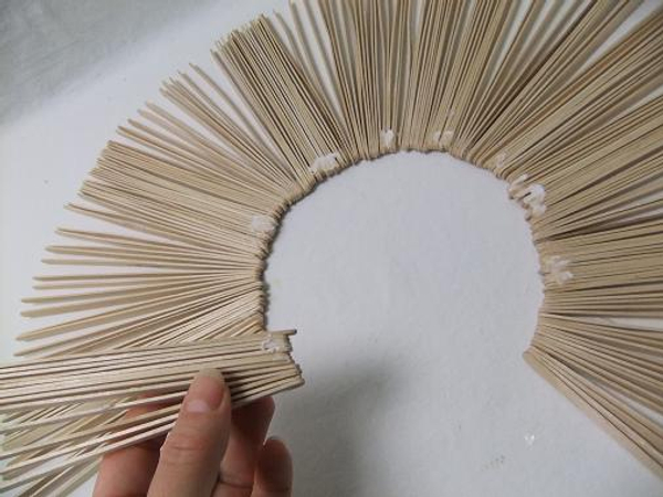 Glue the sections to form the sunburst shape. Glue the sections to form the sunburst shape.