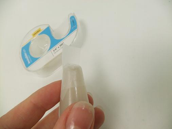 Place a small sticky dot or double sided tape on the bottom of the tube.jpg