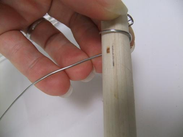 Wrap the wire tightly around the dowel stick.