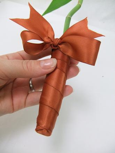 You can use the same technique to wrap a bouquet or posy stems with ribbon