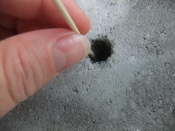 Place epoxy glue deep into the hole