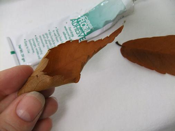 Roll the autumn leaves into cone shapes.