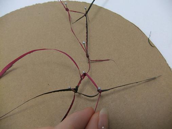 Carefully knot each strand to another strand and secure with a pin Carefully knot each strand to another strand and secure with a pin
